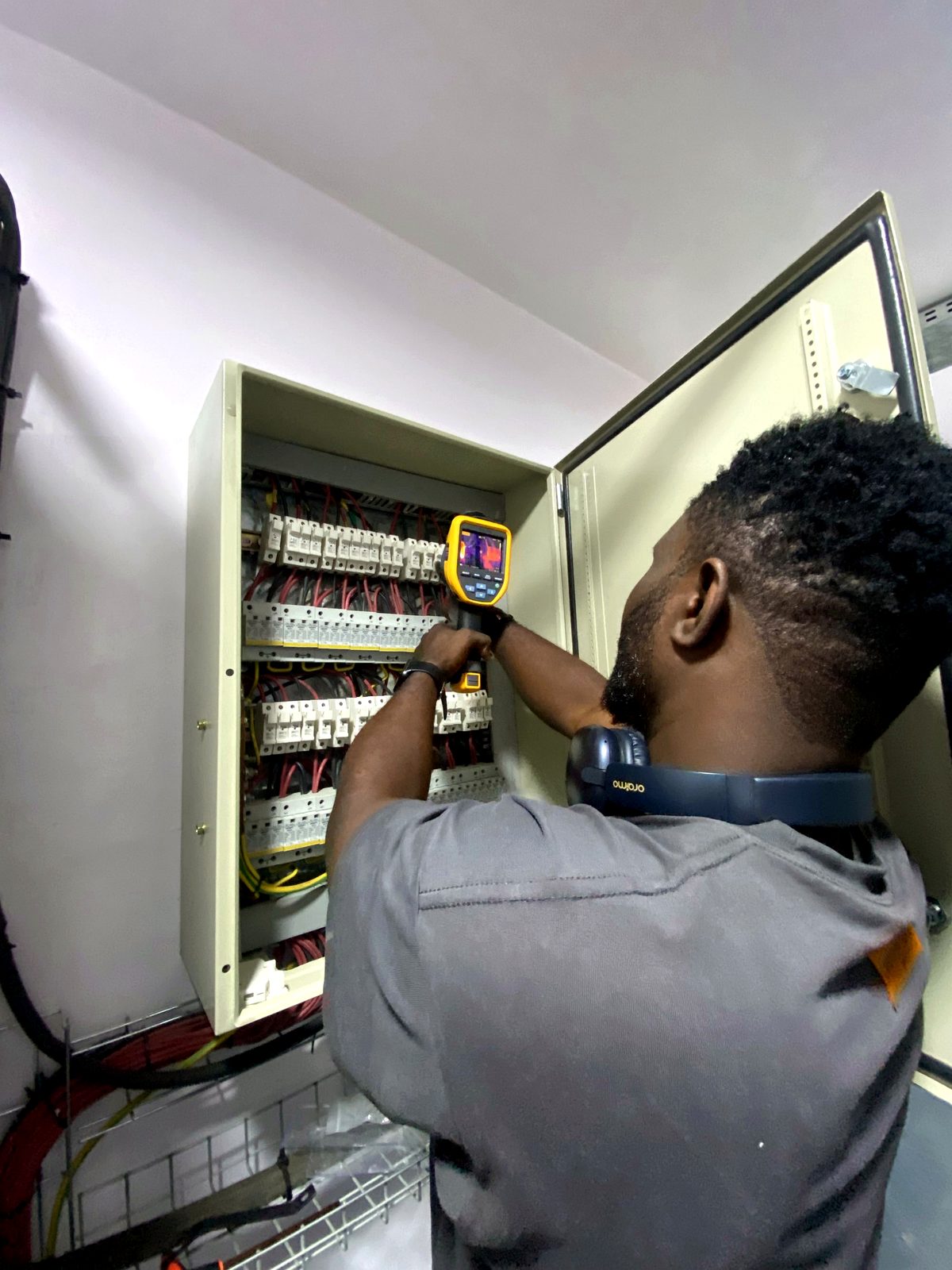 Engineer testing a distribution board